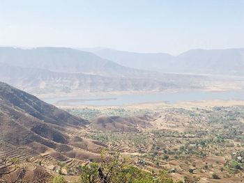 Scenic view of landscape and mountains against sky