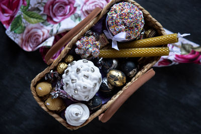 Sanctified orthodox easter basket with eggs, easter bread and candles