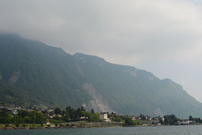 Scenic view of bay against mountains
