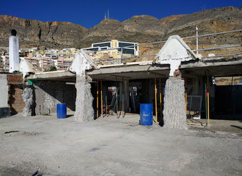 Houses in town against sky