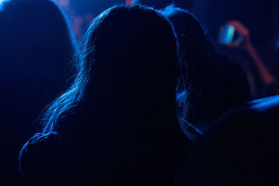 Silhouette woman at music concert