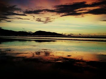 Scenic view of lake at sunset