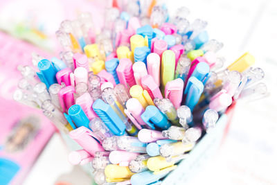 High angle view of multi colored candies in container
