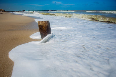 Scenic view of beach against sky