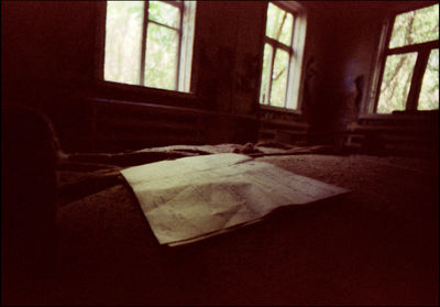 Close-up of messy bed in house