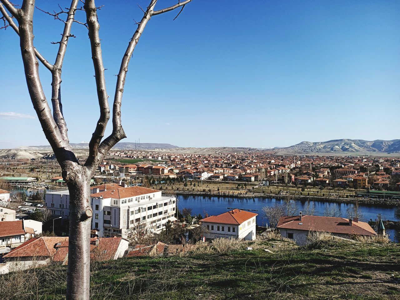 TOWNSCAPE AGAINST CLEAR BLUE SKY