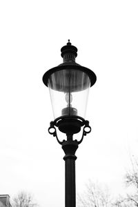 Low angle view of street light against sky