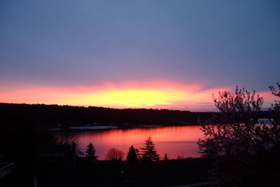 Scenic view of lake at sunset