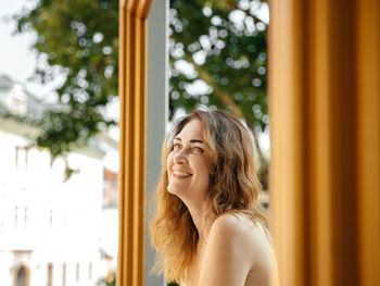 Portrait of young woman looking away