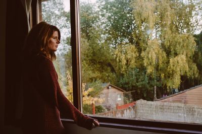 Portrait of young woman looking away