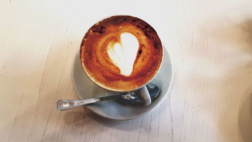 Close-up of coffee cup on table