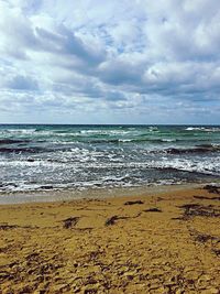 Scenic view of beach against sky