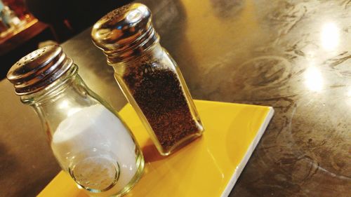 High angle view of bottles on table