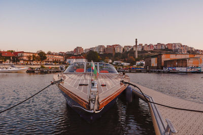 Boats moored at harbor