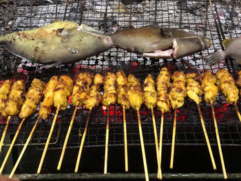 High angle view of meat on barbecue grill