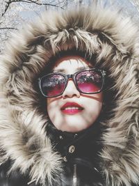 Portrait of beautiful woman wearing fur coat