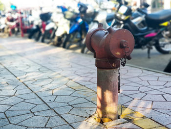 Close-up of fire hydrant on sidewalk