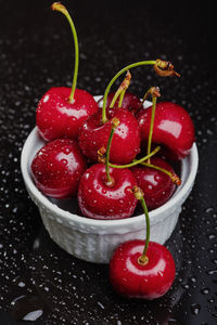 High angle view of red berries on table