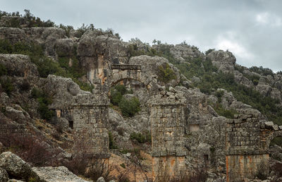 Low angle view of old ruins against sky