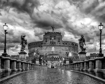 Ponte sant angelo and castel sant angelo in background, rome, italy