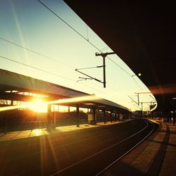 Railroad station platform at sunset