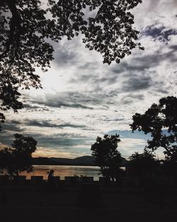 Low angle view of silhouette trees against sky at sunset