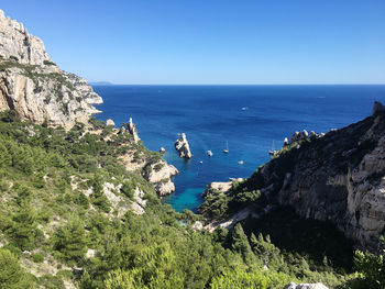 Scenic view of sea against clear blue sky