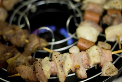 Close-up of serving meat on barbecue grill