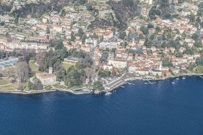 High angle view of townscape by sea