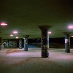 Illuminated street lights in building at night