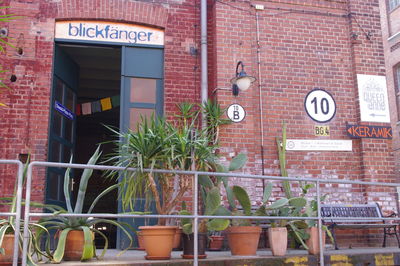 Road sign against brick wall