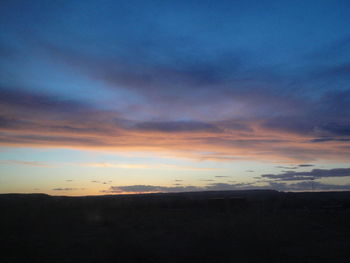 Scenic view of dramatic sky during sunset