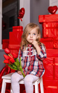 Beautiful girl with flowers. adorable kid with a spring flower.