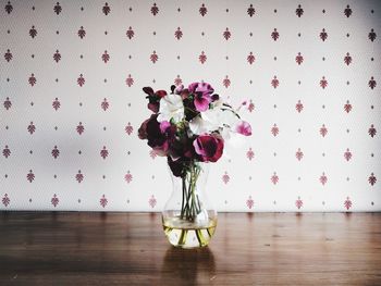 Close-up of flower bouquet in vase on table