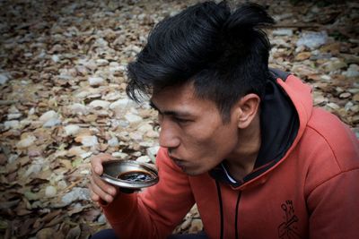 Portrait of young man looking at camera