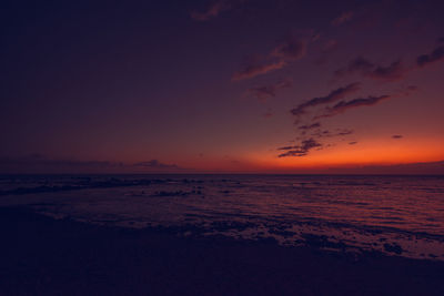 Scenic view of sea against sky at sunset