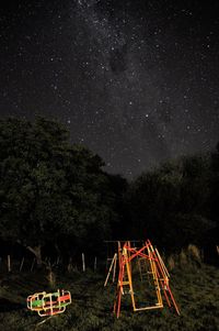 Scenic view of field against sky at night