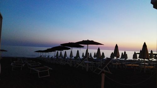 Panoramic view of beach against sky during sunset