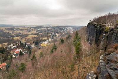 High angle view of buildings and mountains against sky