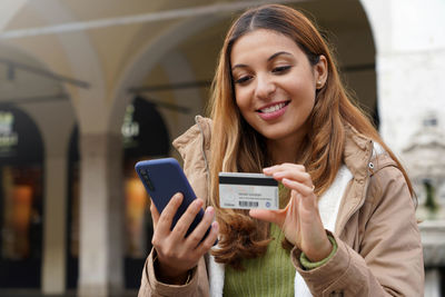 Young woman using mobile phone