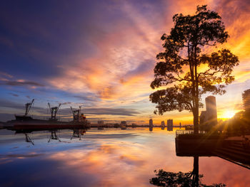 Scenic view of lake against sky during sunset