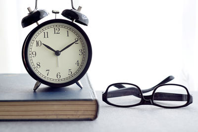 Close-up of clock on table