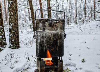 Close-up of fire on snow covered land