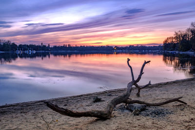 Scenic view of lake against sky during sunset