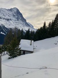 Scenic view of snow covered mountains against sky