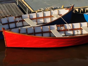 Boats moored on sea against sky