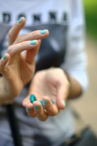 Cropped image of hand holding toy