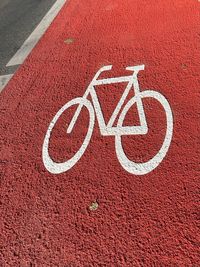 High angle view of arrow sign on road