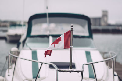 Canadian flag on railing of boat