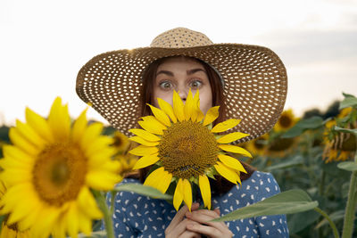 Portrait of woman wearing hat against sky